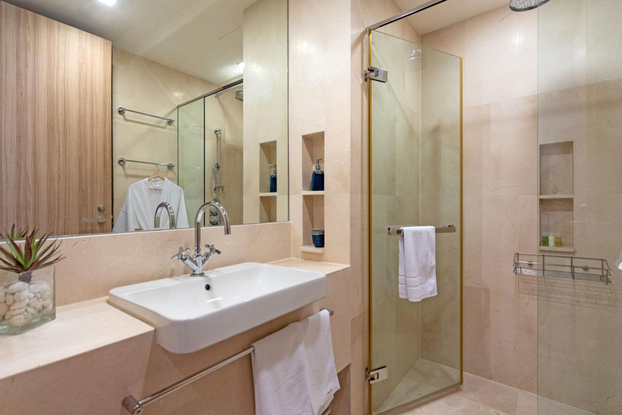 Luxury attached bathroom design featuring premium sanitary fittings, elegant vanity units, modern tiling, glass shower enclosures, and sophisticated interior finishes.