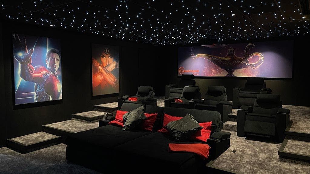 Luxury home theatre interior design in Lucknow with cinematic seating and ambient lighting